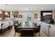 Dining area with seating for ten and access to kitchen and living spaces for entertaining at 2151 Noble Perch St, Las Vegas, NV 89138