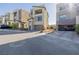 Modern home with a two-car garage, desert landscaping, and ample driveway parking at 2151 Noble Perch St, Las Vegas, NV 89138