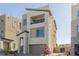 Contemporary two-story home with a balcony, neutral stucco, and a two-car garage at 2151 Noble Perch St, Las Vegas, NV 89138