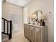 Hallway area with decorative mirror and front facing windows bringing in natural light at 2151 Noble Perch St, Las Vegas, NV 89138