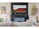 Living room featuring fireplace, modern décor, comfortable seating, and natural light at 2151 Noble Perch St, Las Vegas, NV 89138
