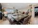 Cozy living area with balcony access, dining area, and a staircase to another level at 2151 Noble Perch St, Las Vegas, NV 89138