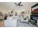 Open-concept living room flows into the kitchen, featuring a sleek fireplace and modern decor at 2151 Noble Perch St, Las Vegas, NV 89138