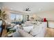 Bright living room features balcony access, modern furniture, and a decorative poker game at 2151 Noble Perch St, Las Vegas, NV 89138