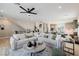 Spacious living area with an open floor plan showcases an expansive seating arrangement and kitchen access at 2151 Noble Perch St, Las Vegas, NV 89138