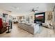 Spacious living room open to the kitchen, featuring modern decor, a fireplace, and ample natural light at 2151 Noble Perch St, Las Vegas, NV 89138