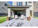Cozy covered patio with stylish seating, elegant planters, and a seamless indoor-outdoor flow at 2151 Noble Perch St, Las Vegas, NV 89138
