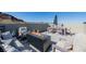 Stylish rooftop patio featuring a fire pit, comfortable seating, dining, and great mountain views at 2151 Noble Perch St, Las Vegas, NV 89138