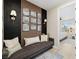 Comfortable sitting room with decorative wall art and access to another room at 2151 Noble Perch St, Las Vegas, NV 89138