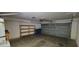 Spacious two-car garage featuring an automatic garage door with storage at 2216 Short Pine Dr, Las Vegas, NV 89108