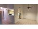Open living area with tile floors flowing into the kitchen area at 2216 Short Pine Dr, Las Vegas, NV 89108