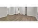 Spacious bedroom features wood-look floors, closet space, and an ensuite bathroom at 2480 Old Forge Ln # 74, Las Vegas, NV 89121