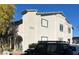 Beautiful white building featuring a private balcony and a personal parking spot at 2480 Old Forge Ln # 74, Las Vegas, NV 89121
