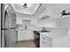 Well-lit kitchen with stainless steel appliances and white cabinets and countertops at 2480 Old Forge Ln # 74, Las Vegas, NV 89121