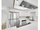 Modern kitchen with stainless steel appliances and white cabinets and countertops at 2480 Old Forge Ln # 74, Las Vegas, NV 89121