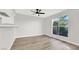 Bright room showcasing wood floors, white walls, and a view of the surrounding greenery at 2480 Old Forge Ln # 74, Las Vegas, NV 89121