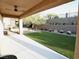 Covered patio looking out onto a manicured backyard with artificial turf at 2623 Red Planet St, Henderson, NV 89044