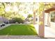 Beautiful backyard with artificial grass, landscaping and patio area at 2623 Red Planet St, Henderson, NV 89044