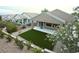 Bird's eye view of backyard featuring artificial turf, desert landscaping, and a covered patio at 2623 Red Planet St, Henderson, NV 89044
