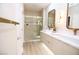 Modern bathroom featuring double sinks, stylish mirrors, and a glass-enclosed shower at 2623 Red Planet St, Henderson, NV 89044