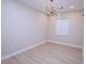 Minimalist bedroom with a modern chandelier and natural light at 2623 Red Planet St, Henderson, NV 89044