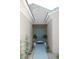 Welcoming front entrance with a stylish blue door, potted plants, and decorative landscaping leading to the home at 2623 Red Planet St, Henderson, NV 89044
