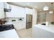 Stylish kitchen featuring white cabinets, stainless steel appliances, quartz countertops, and a spacious center island at 2623 Red Planet St, Henderson, NV 89044