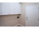 Practical laundry room with white cabinets and convenient access at 2623 Red Planet St, Henderson, NV 89044