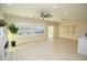 Bright and airy living room featuring backyard views, a sliding glass door and accent fireplace at 2623 Red Planet St, Henderson, NV 89044
