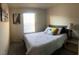 Inviting bedroom with a plush bed, neutral tones, soft lighting, and stylish decor creating a peaceful retreat at 2629 Mocha Pearl Ct, North Las Vegas, NV 89086