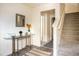 Inviting entryway with a glass table and stairway at 2629 Mocha Pearl Ct, North Las Vegas, NV 89086