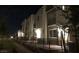 Townhouse community featuring manicured lawns, modern architecture, and walkways at 2629 Mocha Pearl Ct, North Las Vegas, NV 89086