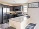 A full kitchen featuring stainless steel appliances, gray cabinets, and an island at 2629 Mocha Pearl Ct, North Las Vegas, NV 89086