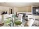 Bright open concept living space with a breakfast bar, dining table, and comfortable seating at 2629 Mocha Pearl Ct, North Las Vegas, NV 89086