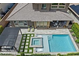 Aerial view of a home and backyard pool, spa, and patio with plenty of seating at 2680 Nevada Agave Ln, Las Vegas, NV 89138