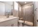 This bathroom offers a tiled glass shower, modern sink and vanity at 2680 Nevada Agave Ln, Las Vegas, NV 89138