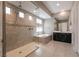 Bright bathroom features a glass shower, tub, and vanity sink at 2680 Nevada Agave Ln, Las Vegas, NV 89138