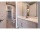 A modern sink and vanity adjoin a half-view of a second bathroom with shower at 2680 Nevada Agave Ln, Las Vegas, NV 89138
