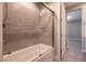 A bathroom area showcases a clean tub and shower combination with glass doors at 2680 Nevada Agave Ln, Las Vegas, NV 89138