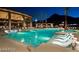 Inviting community pool with chaise lounges and covered seating areas; perfect for relaxation at 2680 Nevada Agave Ln, Las Vegas, NV 89138
