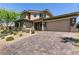 Stunning home with a three-car garage and a gorgeous brick driveway at 2680 Nevada Agave Ln, Las Vegas, NV 89138