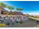 The Reverence community entrance with stone accents and lush landscaping at 2680 Nevada Agave Ln, Las Vegas, NV 89138