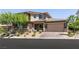 Beautiful two-story home featuring a three-car garage and well-manicured landscaping at 2680 Nevada Agave Ln, Las Vegas, NV 89138