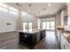 Bright kitchen with a large island, pendant lighting, stainless appliances, and sleek finishes at 2680 Nevada Agave Ln, Las Vegas, NV 89138