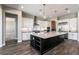 Open-concept kitchen features a large island, stainless steel appliances, and modern finishes at 2680 Nevada Agave Ln, Las Vegas, NV 89138