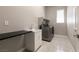 This laundry room features modern appliances, a sink and a countertop space at 2680 Nevada Agave Ln, Las Vegas, NV 89138