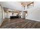Open-concept living space featuring a staircase, hardwood floors, and a modern kitchen at 2680 Nevada Agave Ln, Las Vegas, NV 89138