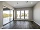 Bright room with backyard view, large windows, and neutral walls and flooring at 2680 Nevada Agave Ln, Las Vegas, NV 89138