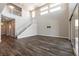 Bright living room with a staircase, hardwood floors, and a sliding glass door at 2680 Nevada Agave Ln, Las Vegas, NV 89138
