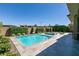 Beautiful backyard pool with spa, lush landscaping, and modern patio, perfect for outdoor entertaining at 2680 Nevada Agave Ln, Las Vegas, NV 89138